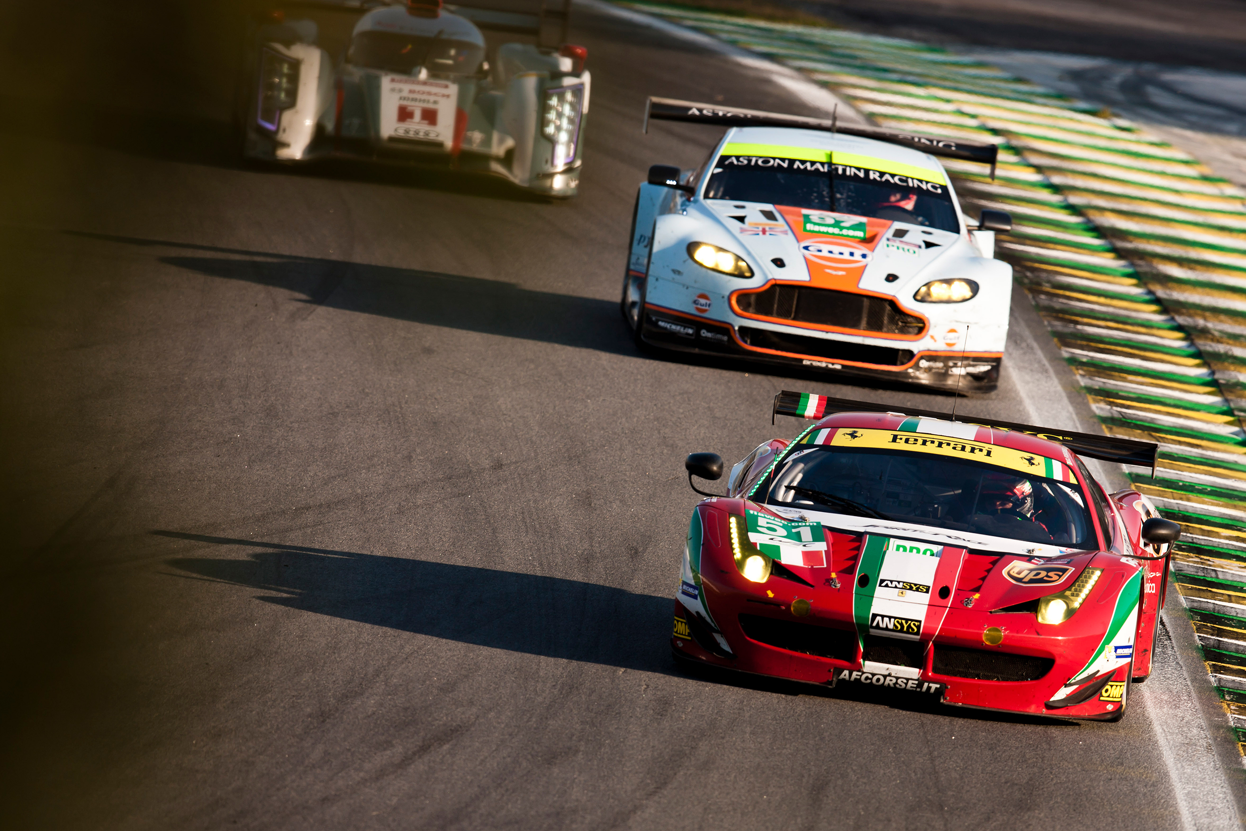 Giancarlo Fisichella, Ferrari 458 Italia leads Stefan Mucke, Aston Martin Vantage