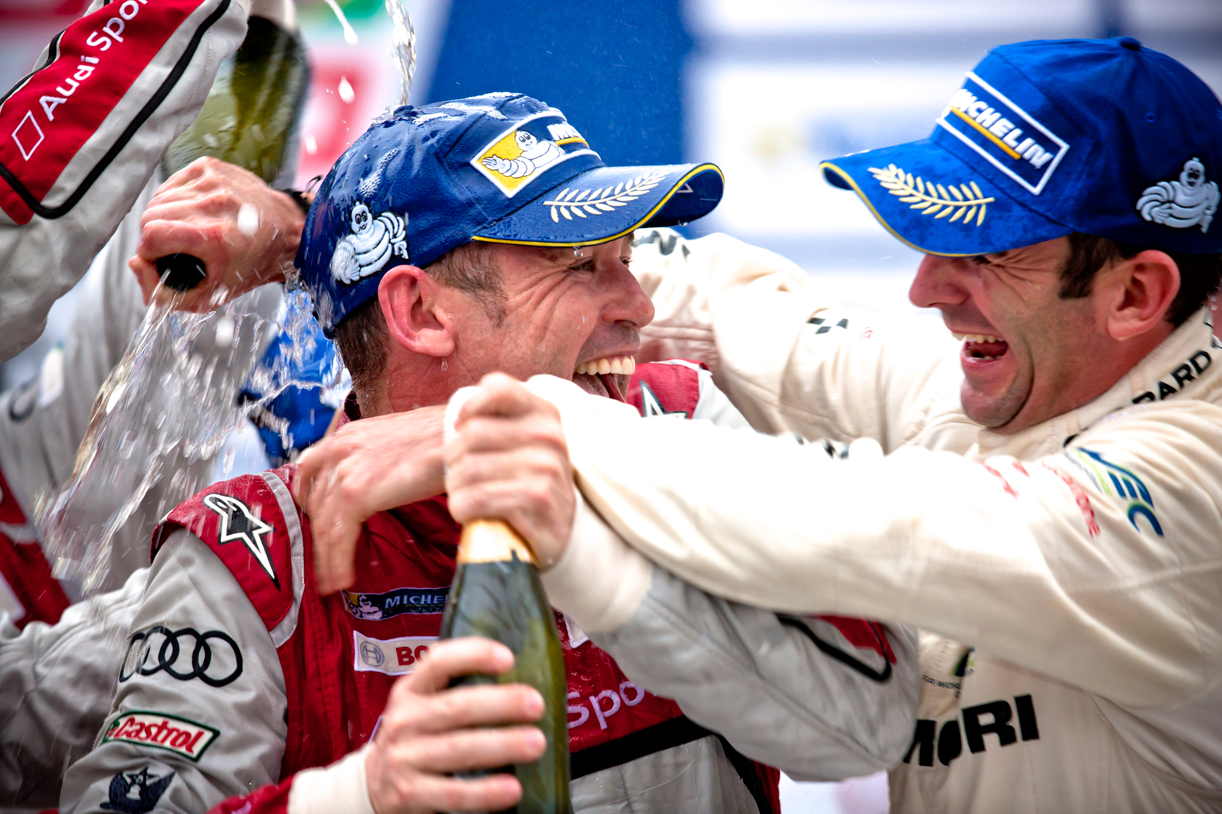 Tom Kristensen and Romain Dumas on the podium