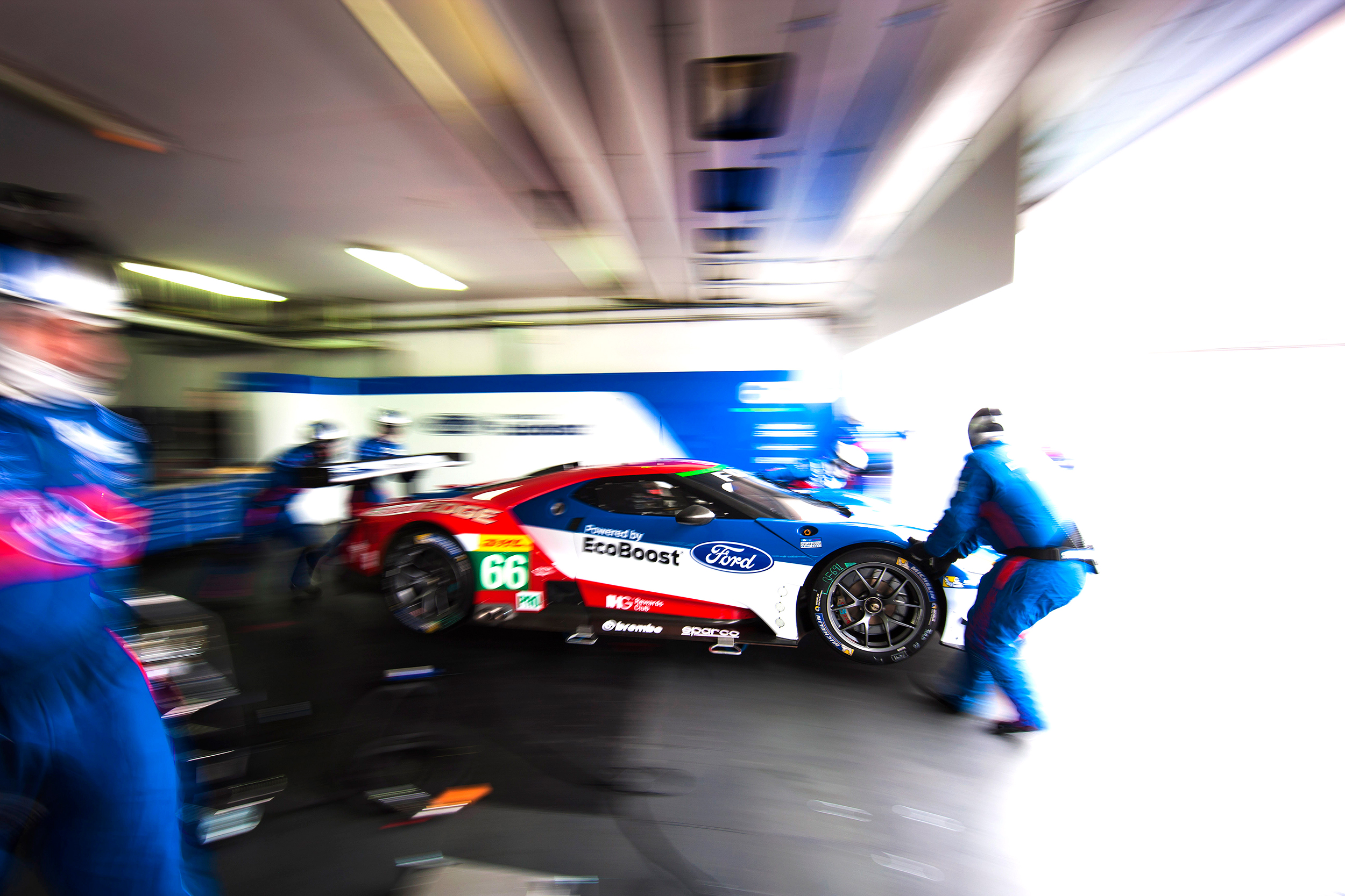 Ford GT is pushed out of the garage by the team