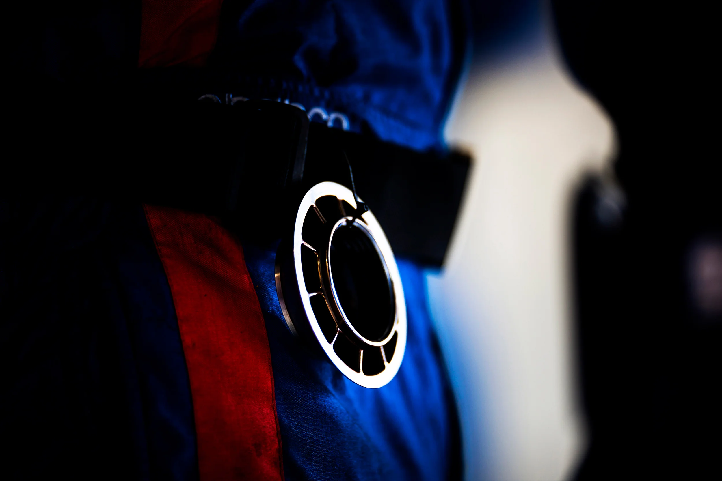 A spare wheel nut on the belt of one of the Ford pit crew