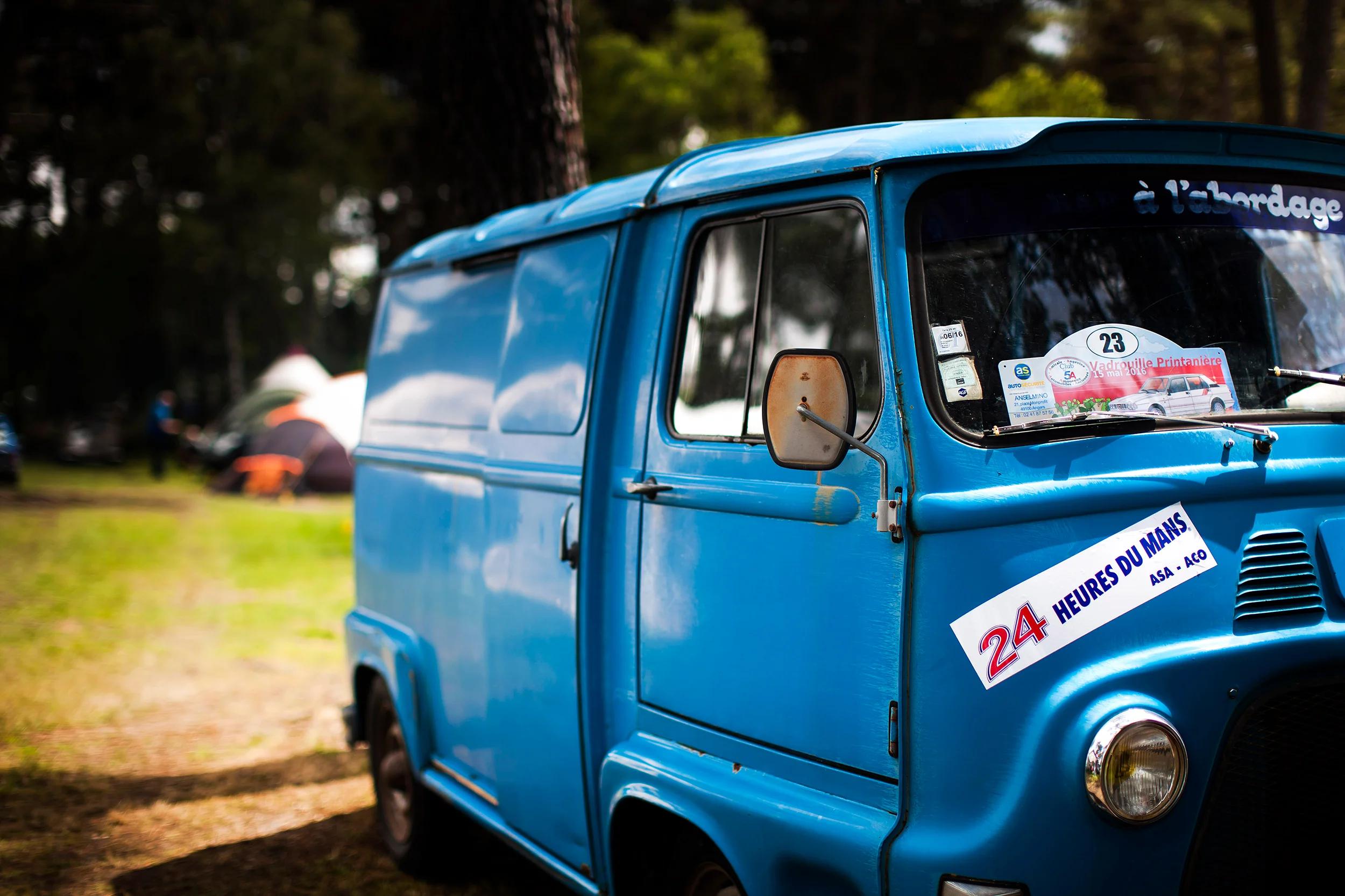 A retro van on a campsite