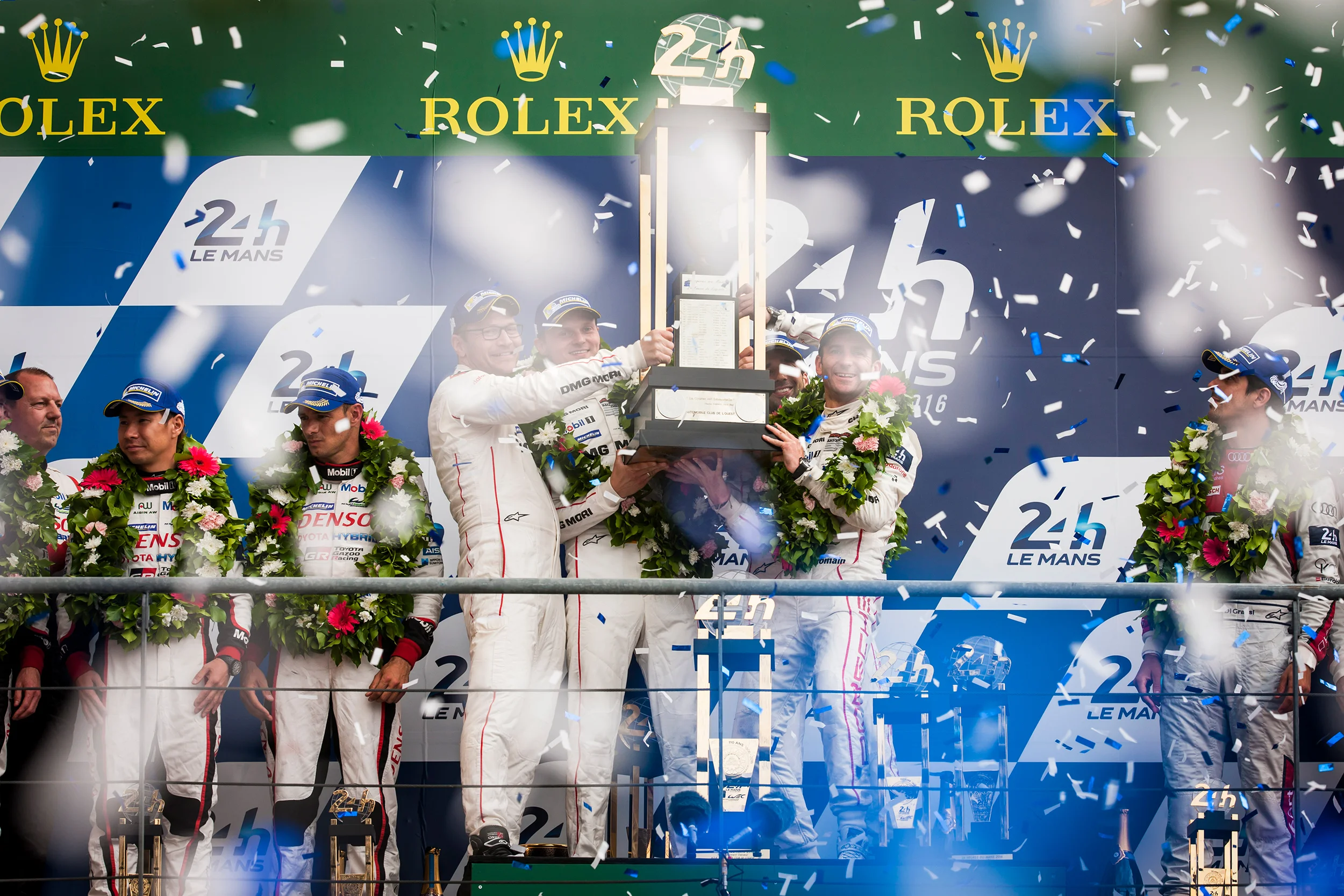 #2 Porsche drivers celebrate victory on the podium
