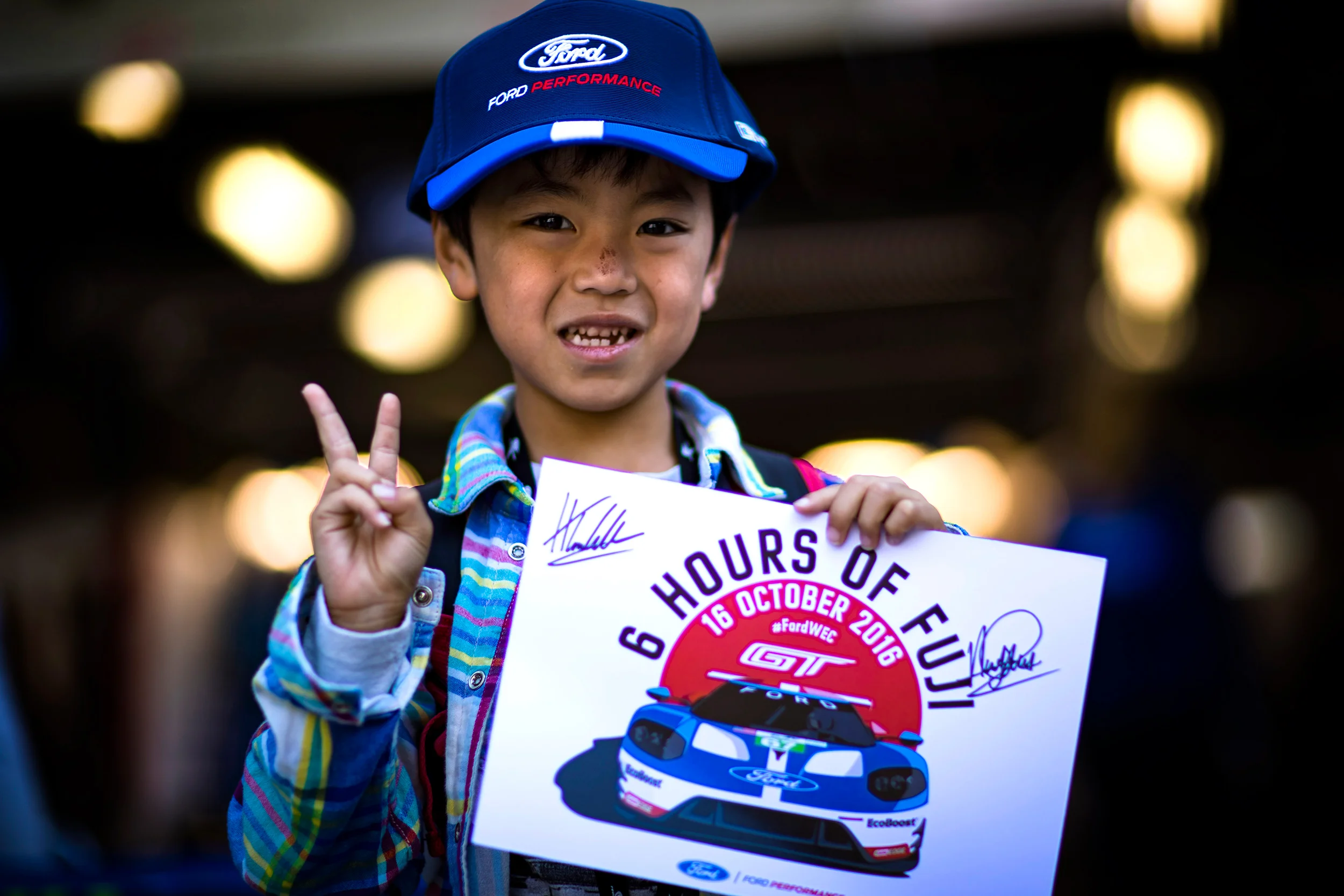 A young fan in the pit lane