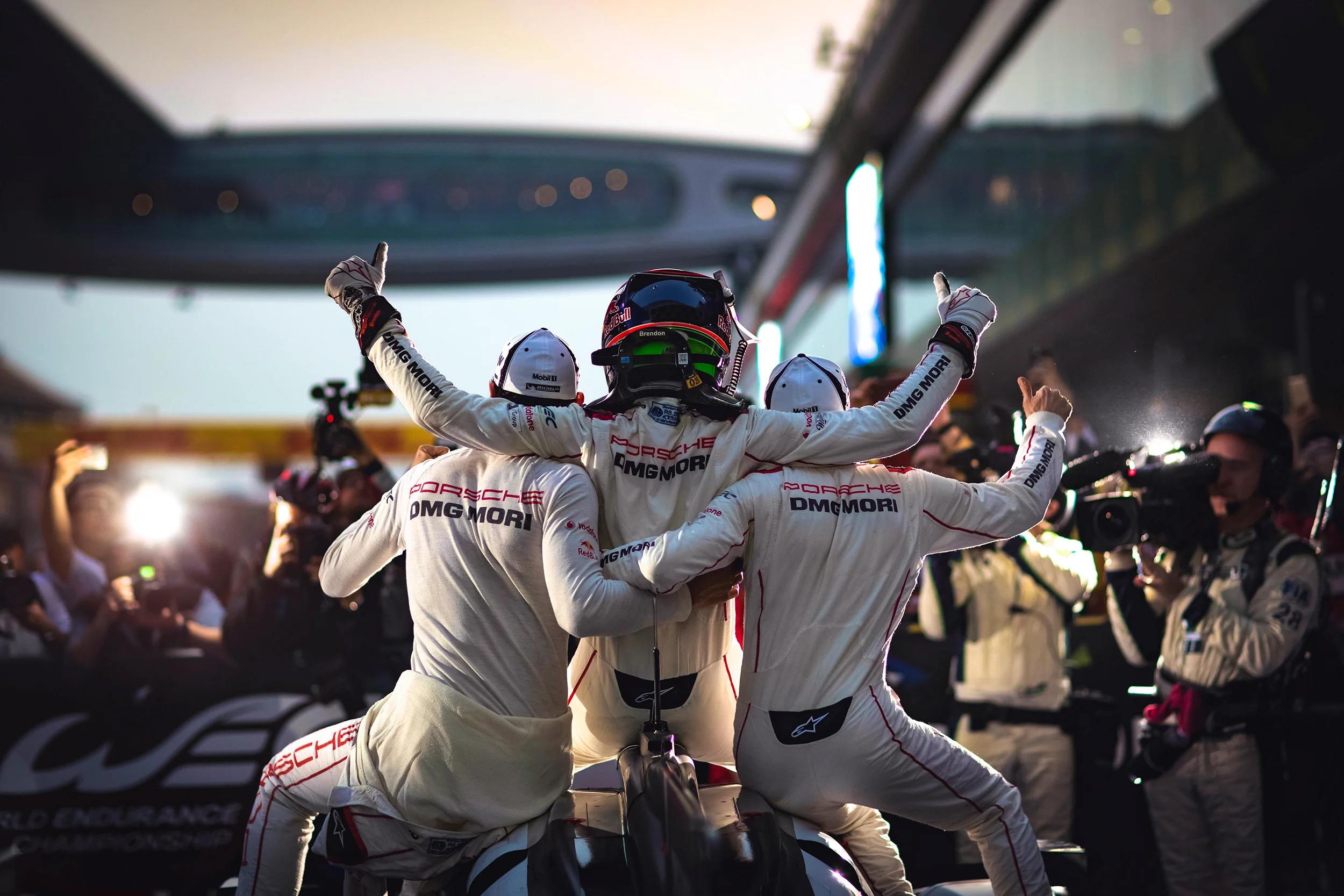 Mark Webber, Brendon Hartley and Timo Bernhard celebrate victory
