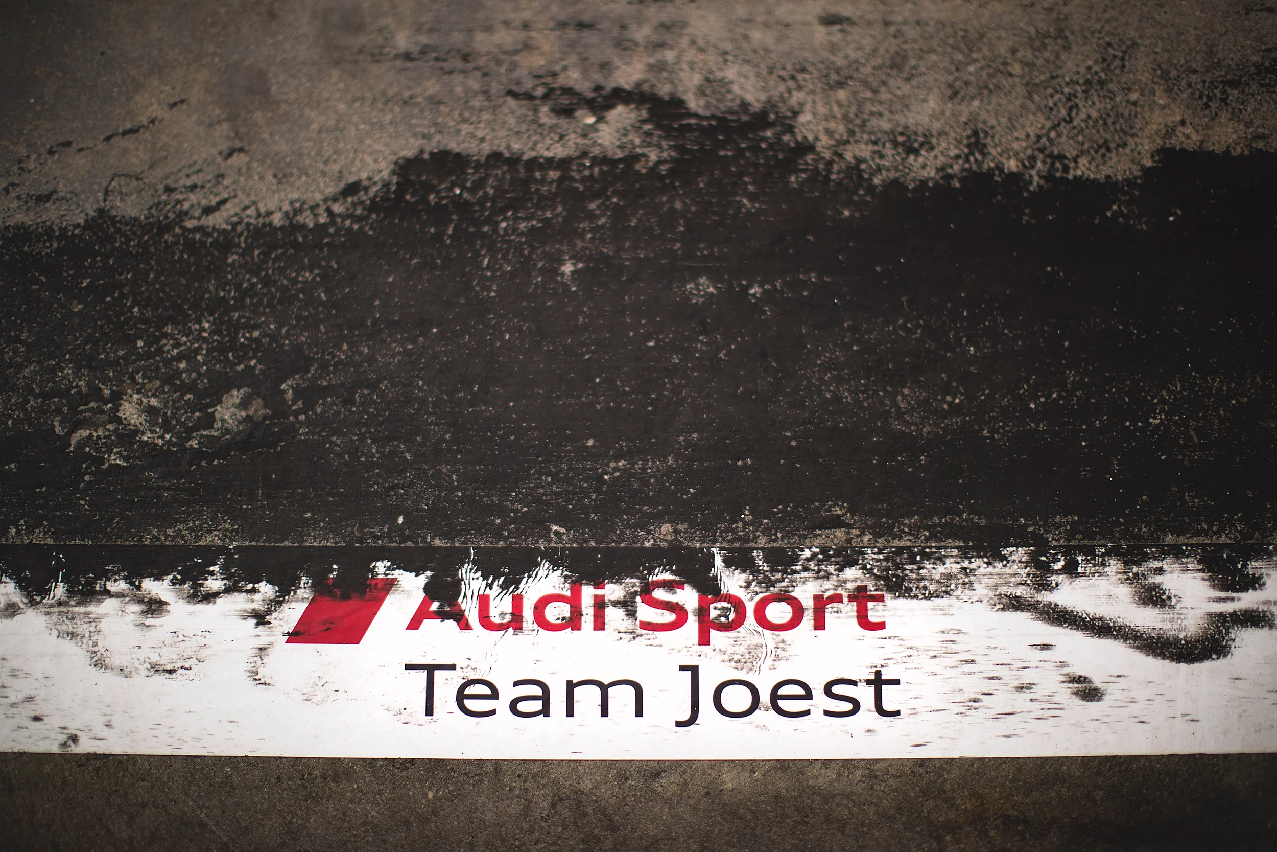Audi Sport Team Joest sticker in the pit lane