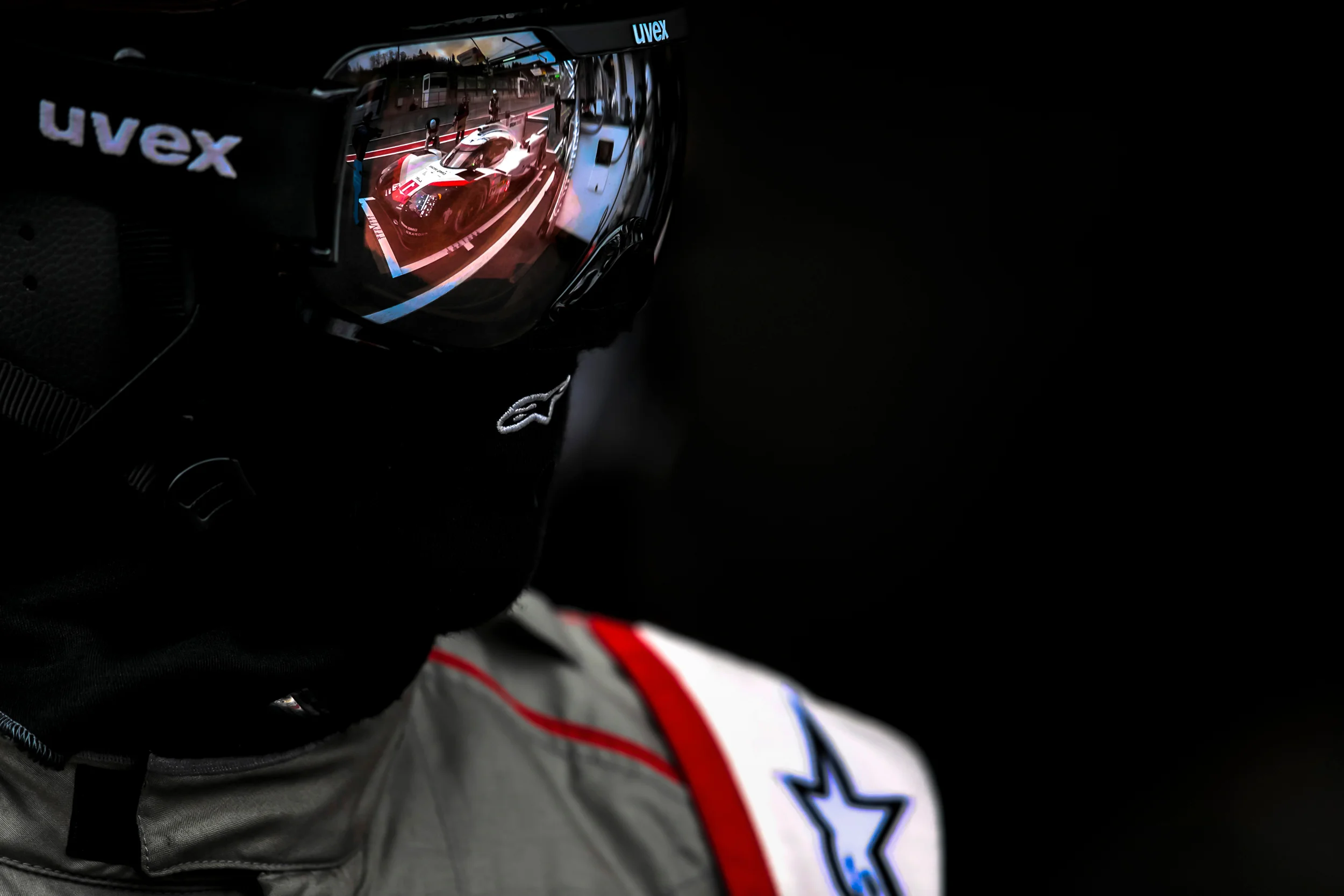 Porsche 919 reflected in the pit crew's goggles