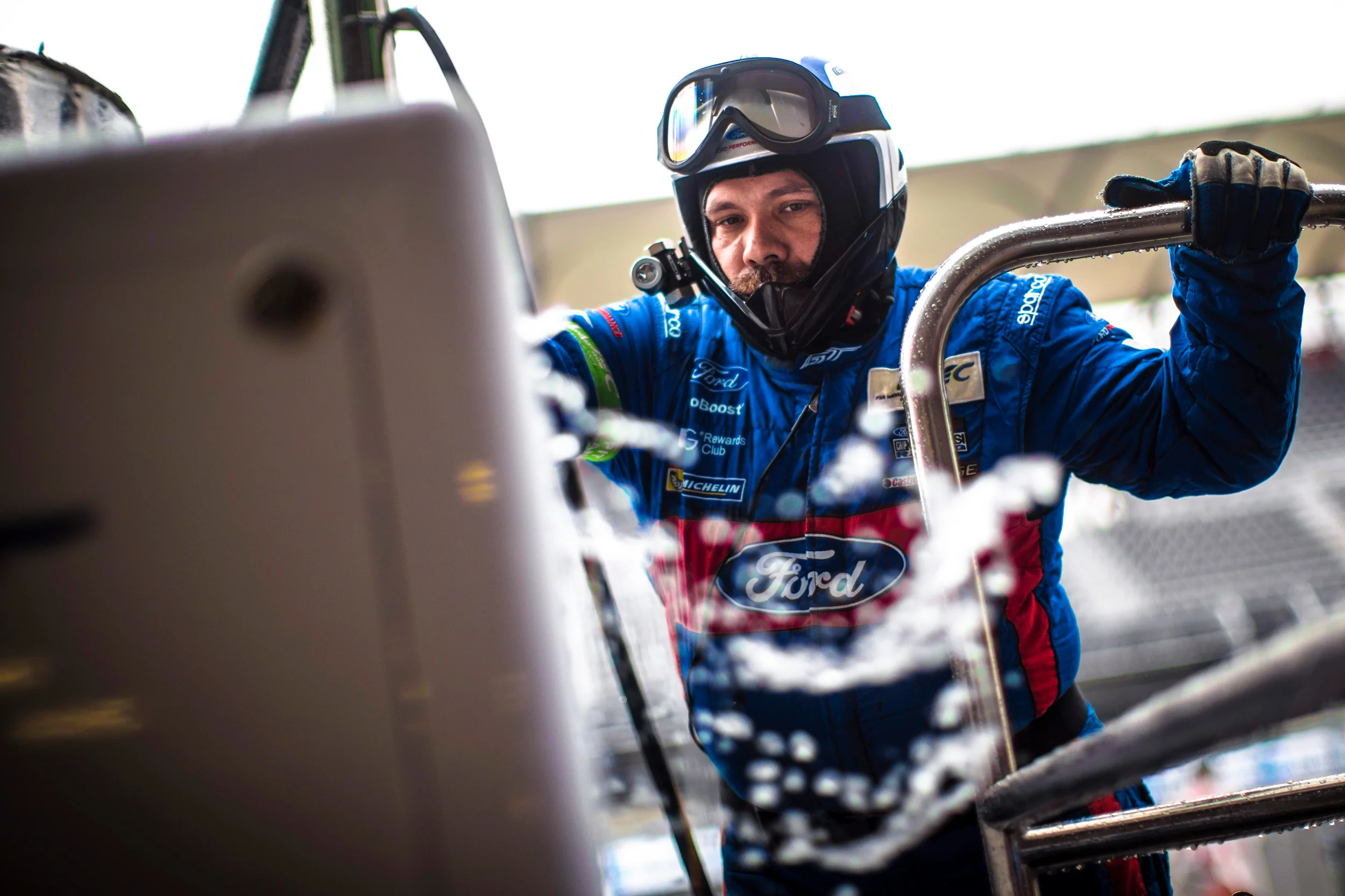 A Ford team member removes water from the refuelling rig