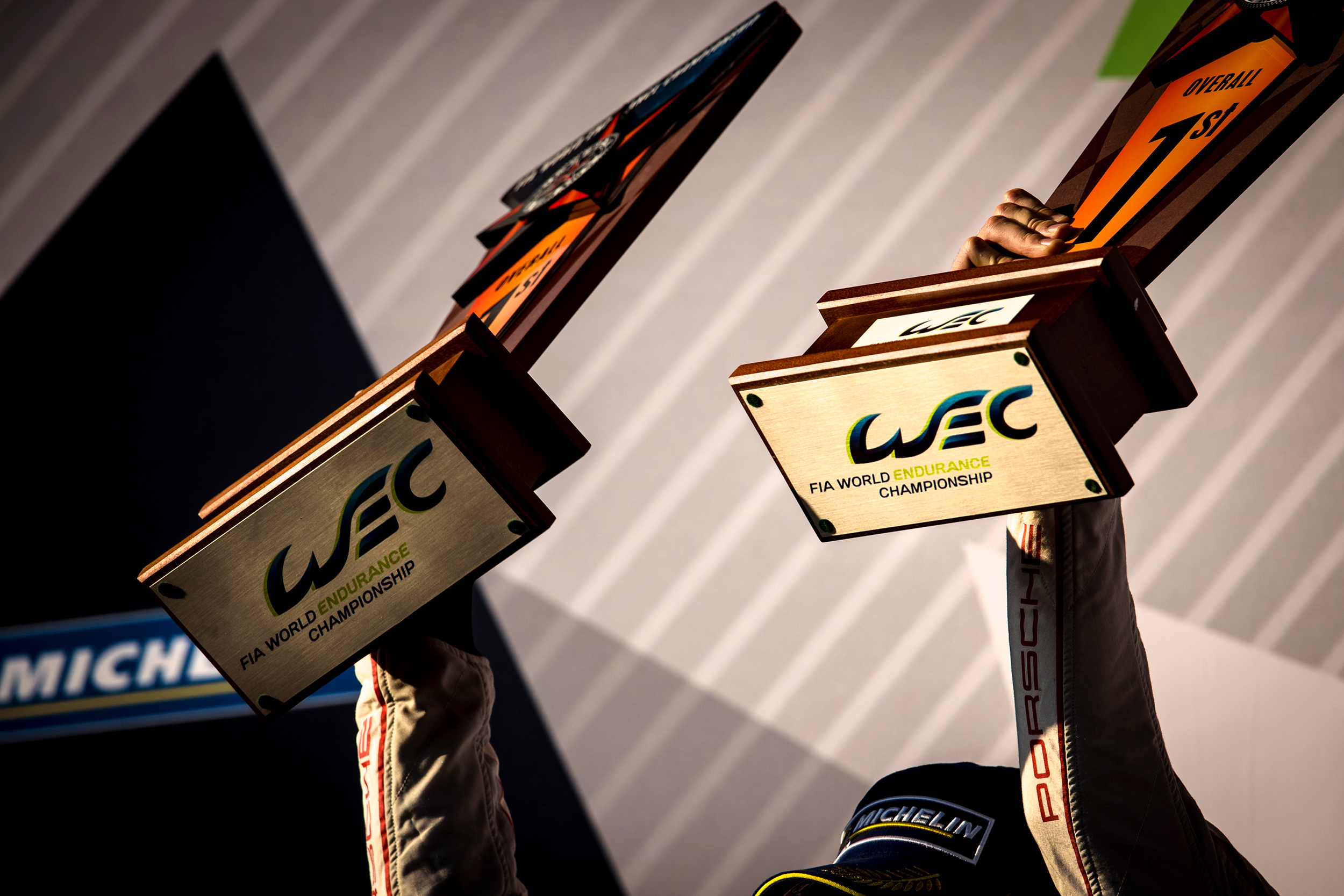 Timo Bernhard and Earl Bamber with their winning trophies