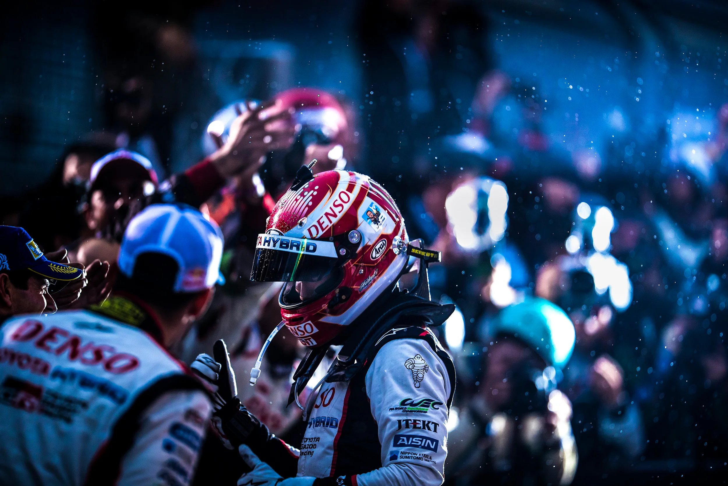 Kazuki Nakajima celebrates victory in parc ferme with Sebastien Buemi and Anthony Davidson