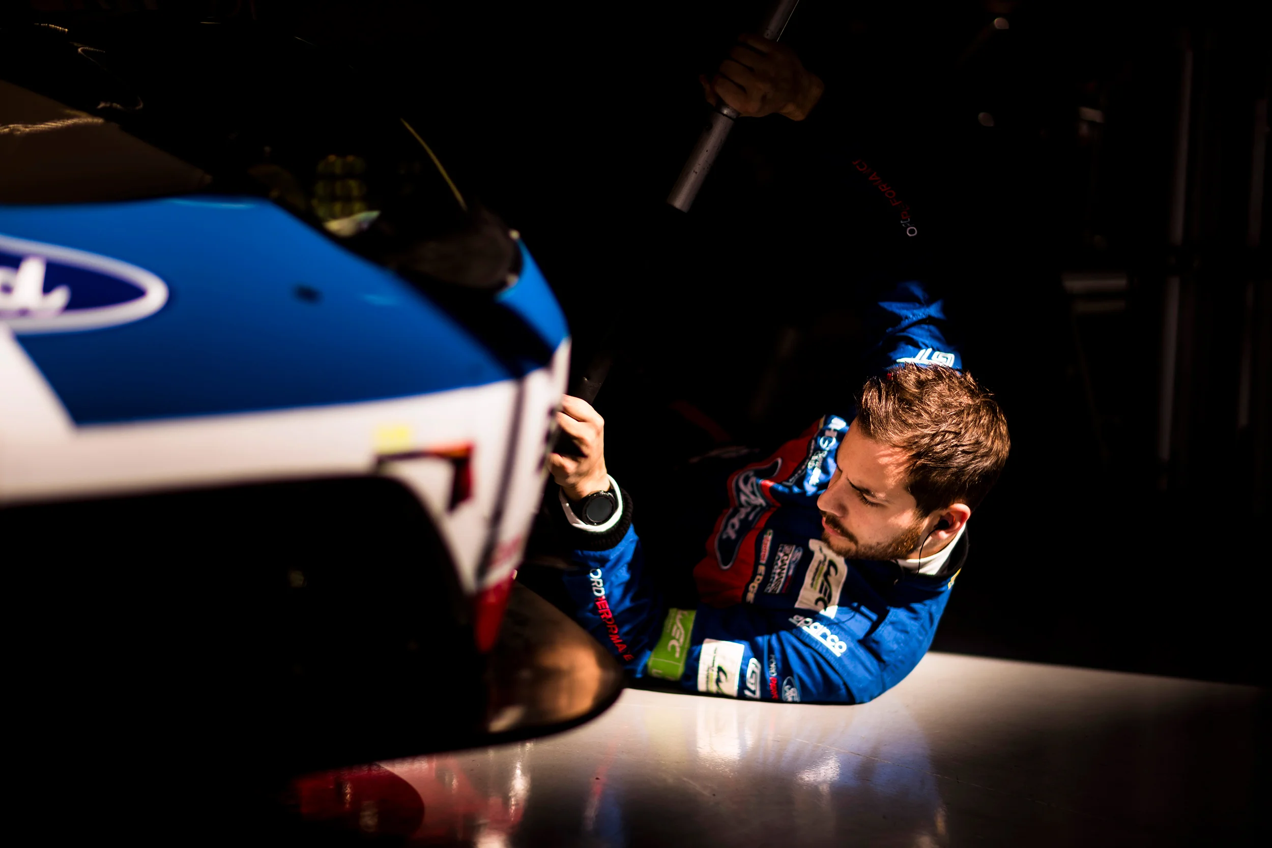 A Ford team member works on the #66 Ford GT