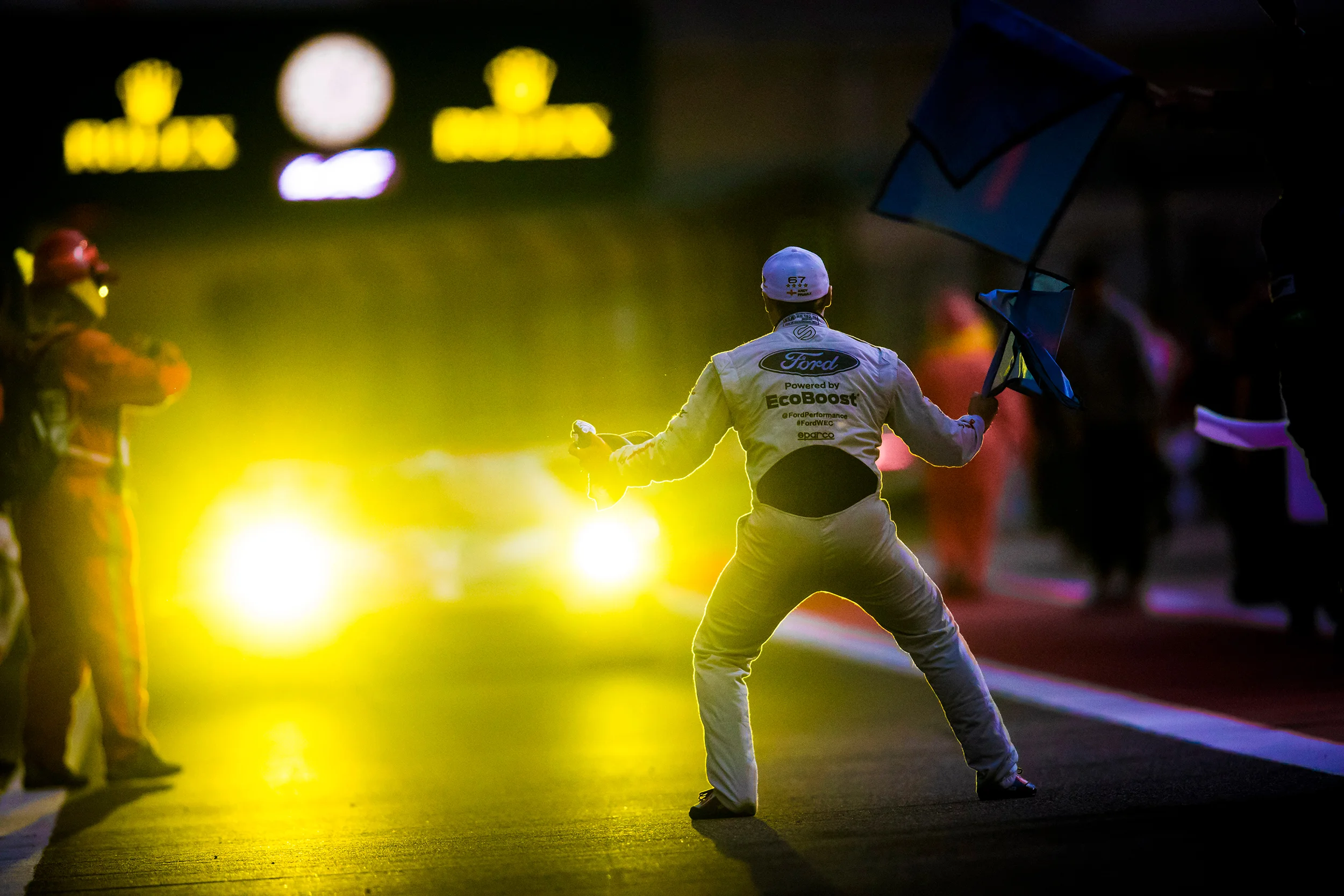 Andy Priaulx celebrates in front of Harry Tincknell, Ford GT