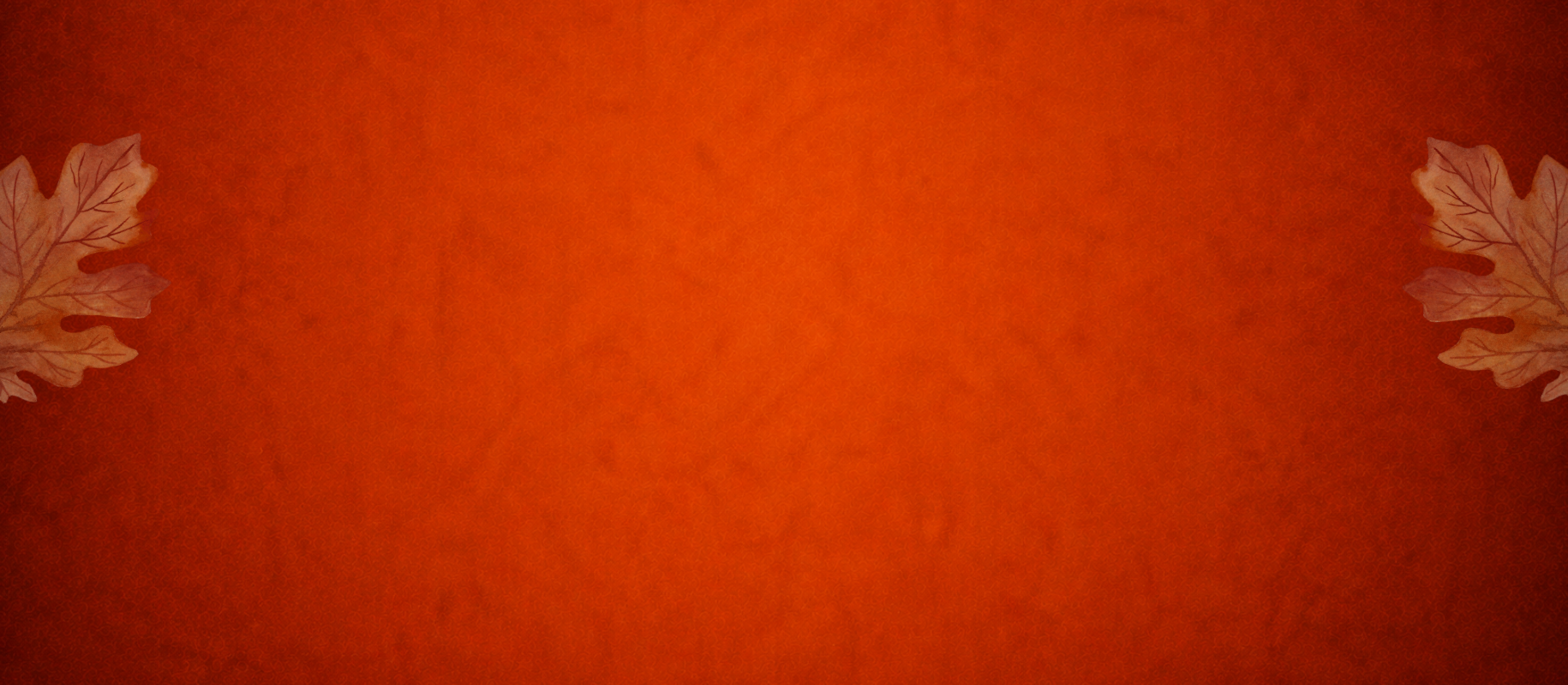 Warm orange fall background with autumn maple leaves
