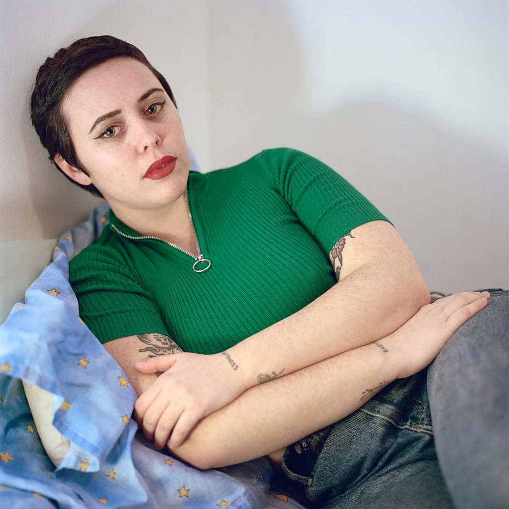 Lora Mathis, Poet, Poetry, Philadelphia, Philly, Pennsylvania, Short Hair, Pixie Cut, Green Sweater, Quarter Zip, Tattoos, Red Lip, Winged Eyeliner, Portrait, Hasselblad, Film, Medium Format Film, Kodak Portra