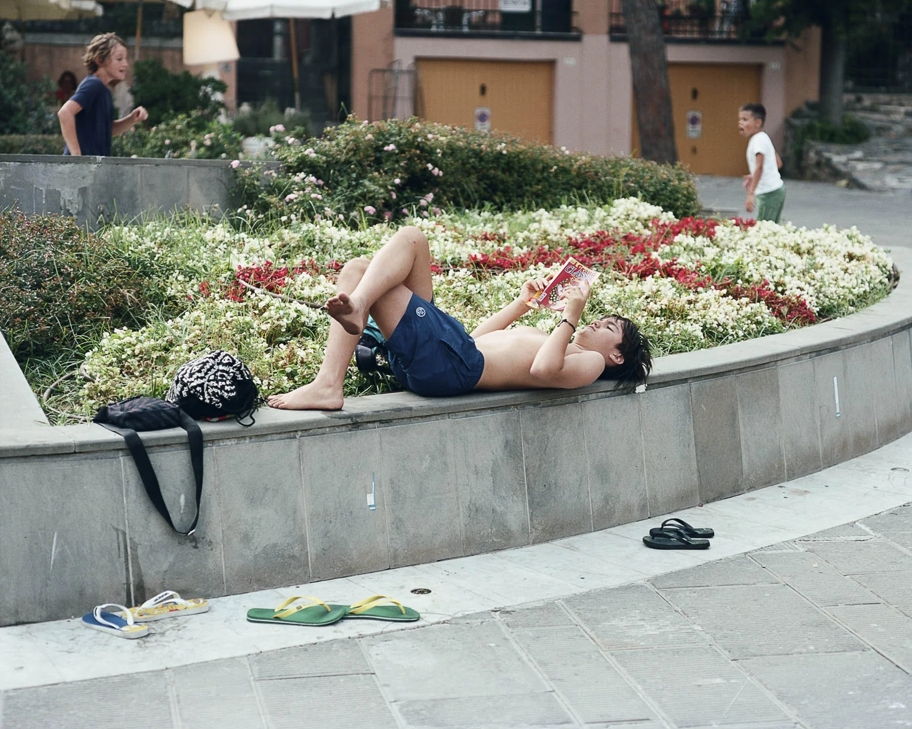 Comic Book, Reading, Playing, Kids, Town Square, Small Town, Summer, Summer Break, Italy, Italian, Europe, Sandals, Portovenere, Cinque Terre, Film, Medium Format Film, Pentax, Kodak Portra