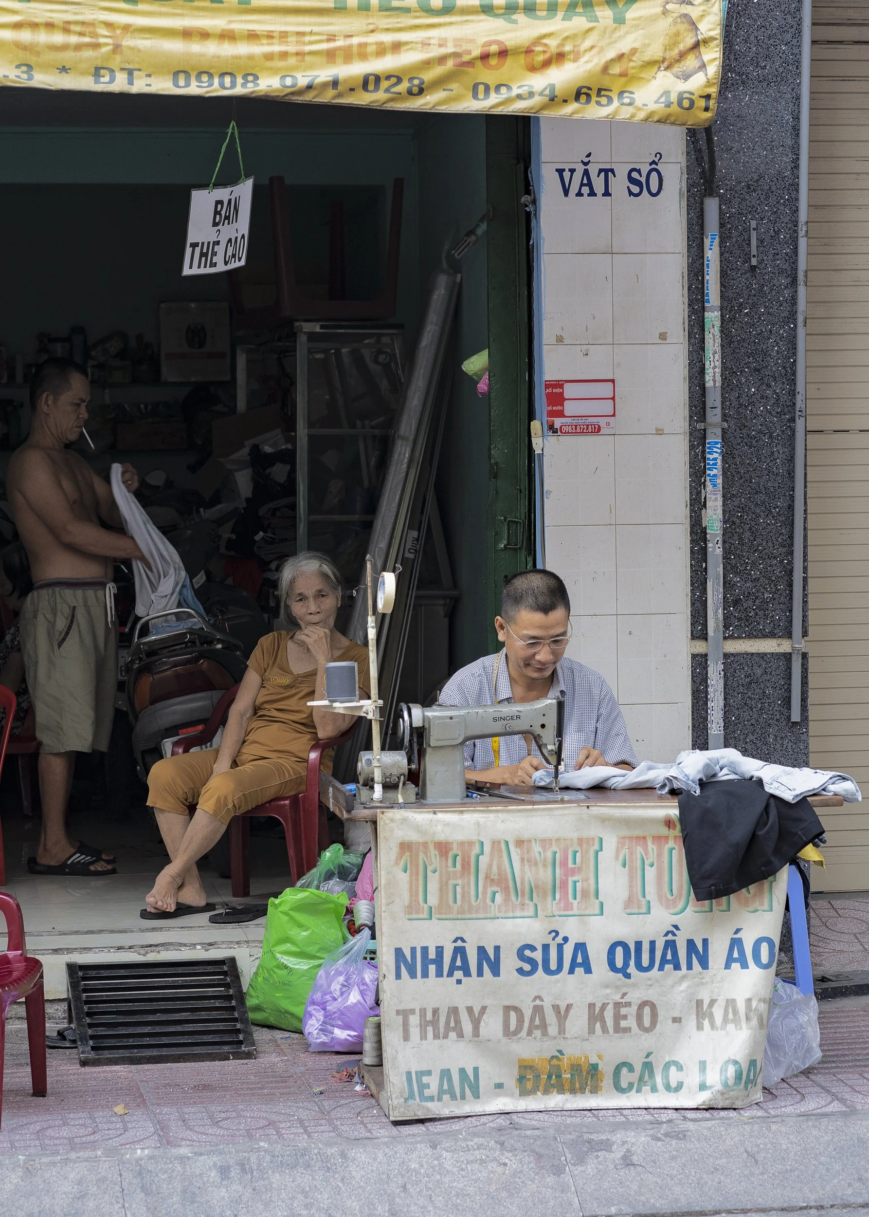 Tailor, Seamstress, Sewing Machine, Making Clothes, Cigarette, Vietnam, Saigon, Southeast Asia, Ho Chi Minh City