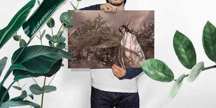 man_holding_paper_mockup.jpg