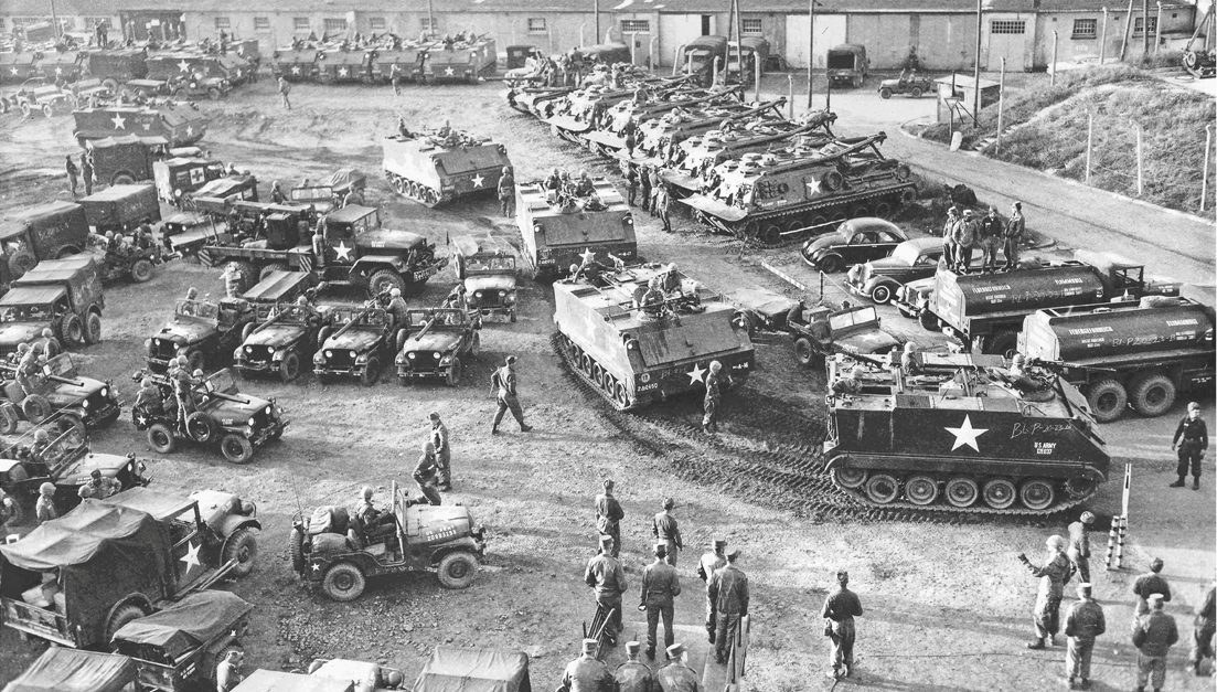 2nd Armored Division troops move out from a pre-positioned equipment location in Germany.