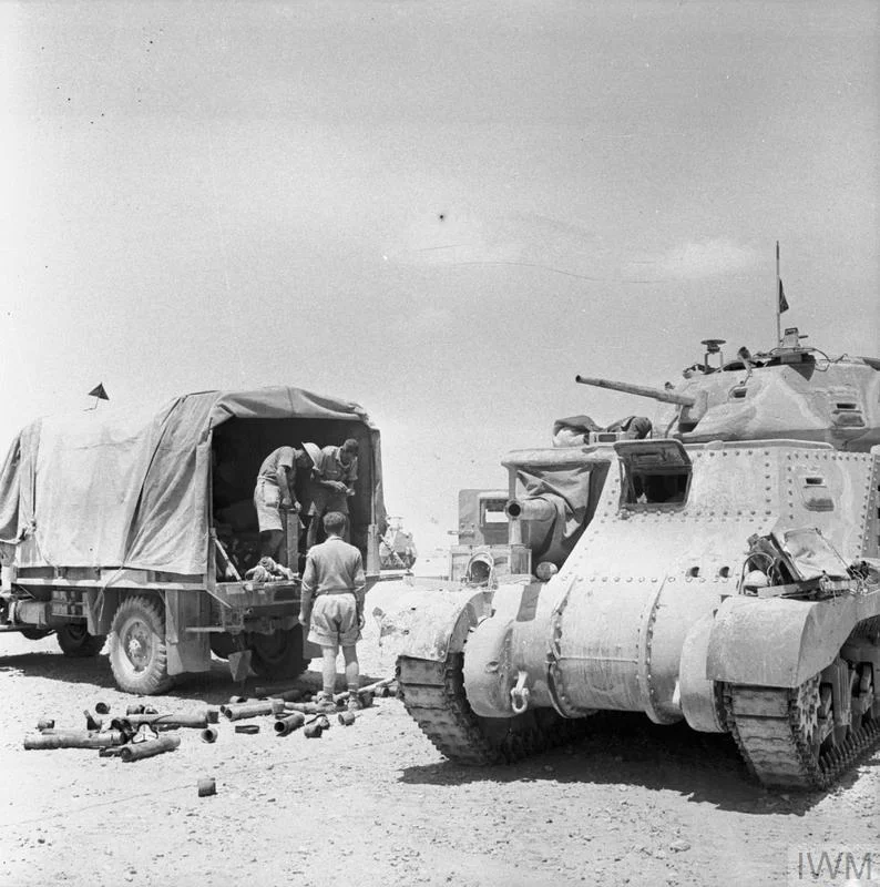 Grant tank crew loading up with ammunition from a truck, 18 June 1942. IWM photo E 13551