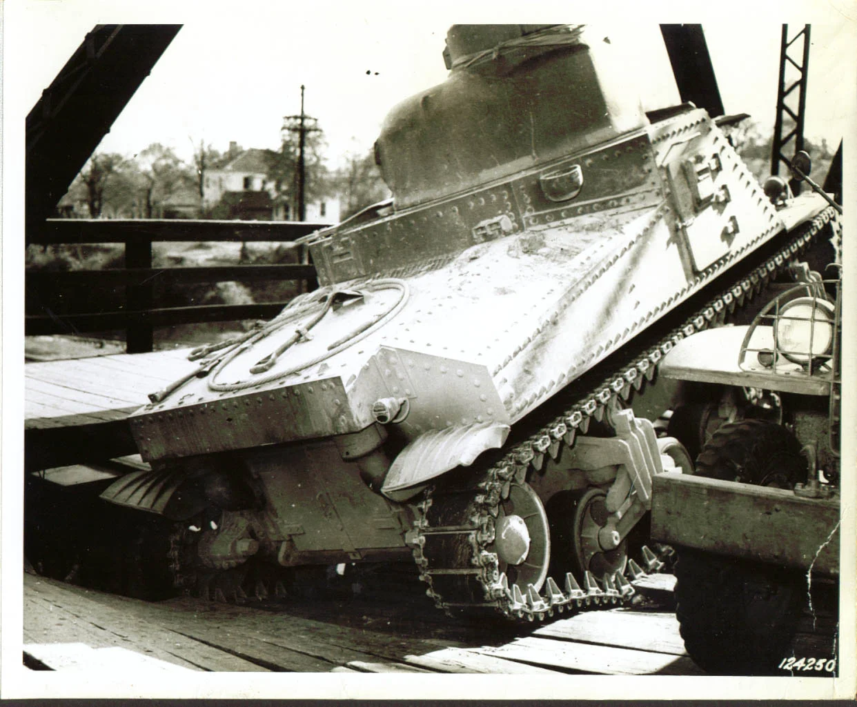1st Army tank cracks bridge deck Monroe, NC 1941 (negative reversed - sponson gun would be on the right side)