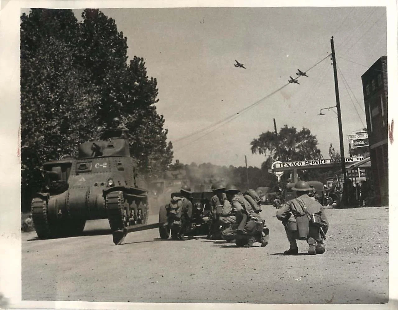 1st Armored Division M3 Lees, supported by A-20 Havocs, blast their way past defending 37mm anti-tanks guns near Castor, Louisiana, 14 Sep 1941.