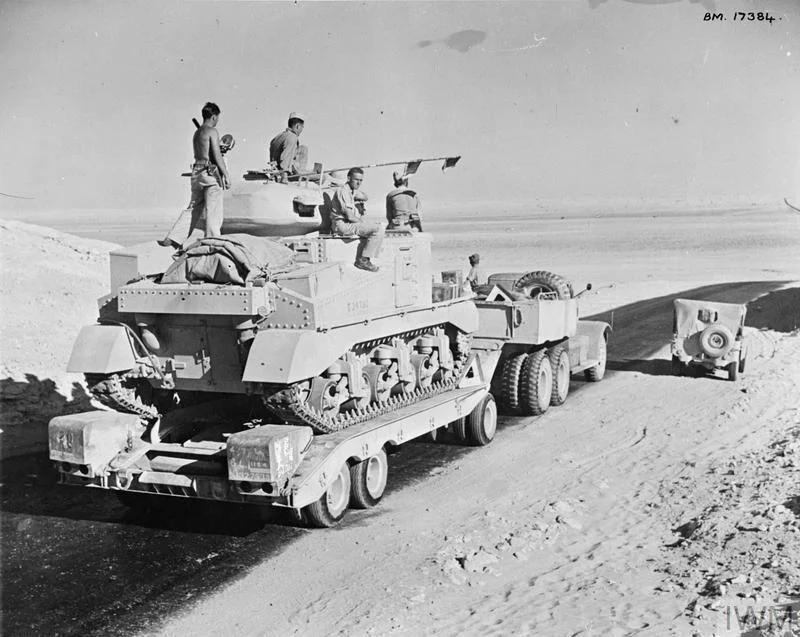 A Grant tank being taken to the forward areas on a Diamond T transporter, 13 Aug 1942. IWM photo E 15583