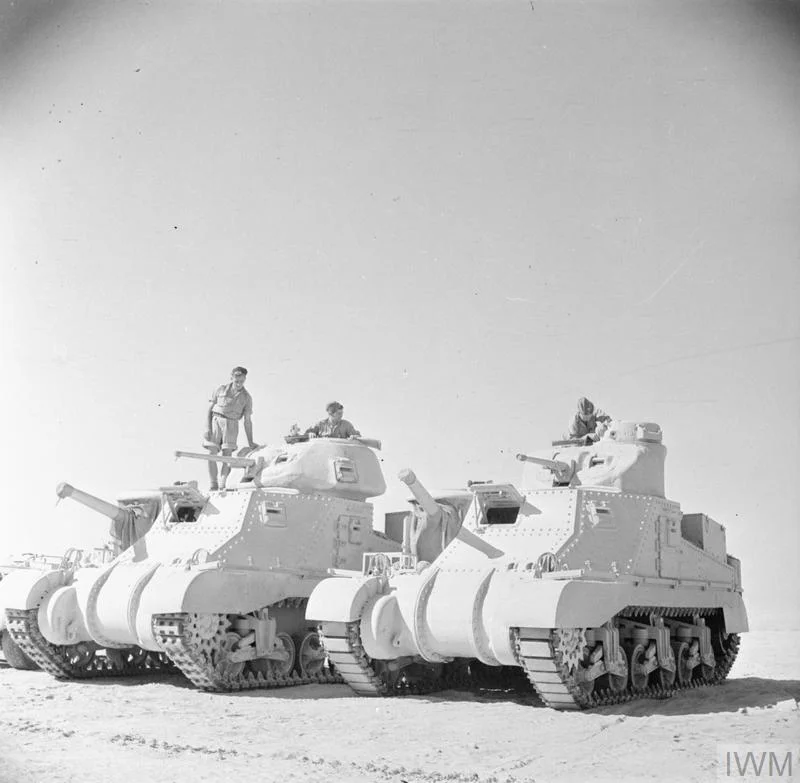 Grant and Lee tanks of 'C' Squadron, 4th (Queen's Own) Hussars, 2nd Armoured Brigade, El Alamein position, Egypt, 7 Jul 1942. IWM photo E 14053