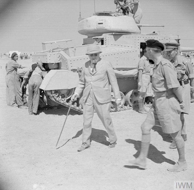 Winston Churchill touring tank units at Tel-el-Kebir, 9 August 1942. A Grant tank can be seen in the background. IWM photo E 15381