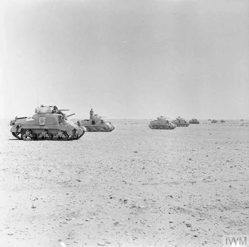 Grant tanks of 22nd Armoured Brigade, 7th Armoured Division, waiting to go into action in the Western Desert, 28 Jul 1942. IWM photo E 14948