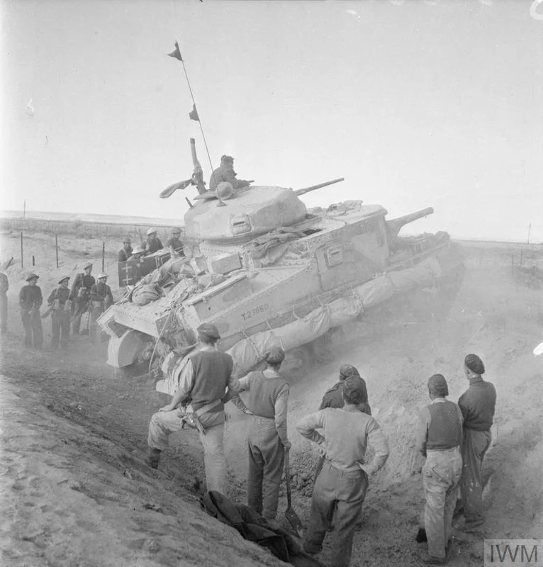 A Grant tank crossing a steep ditch outside Mersa Matruh, 11 Nov 1942. IWM photo E 19316