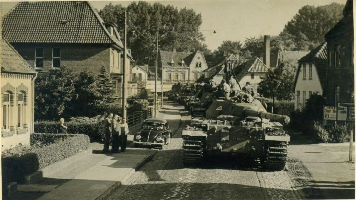 Conquerors passing through a German village.
