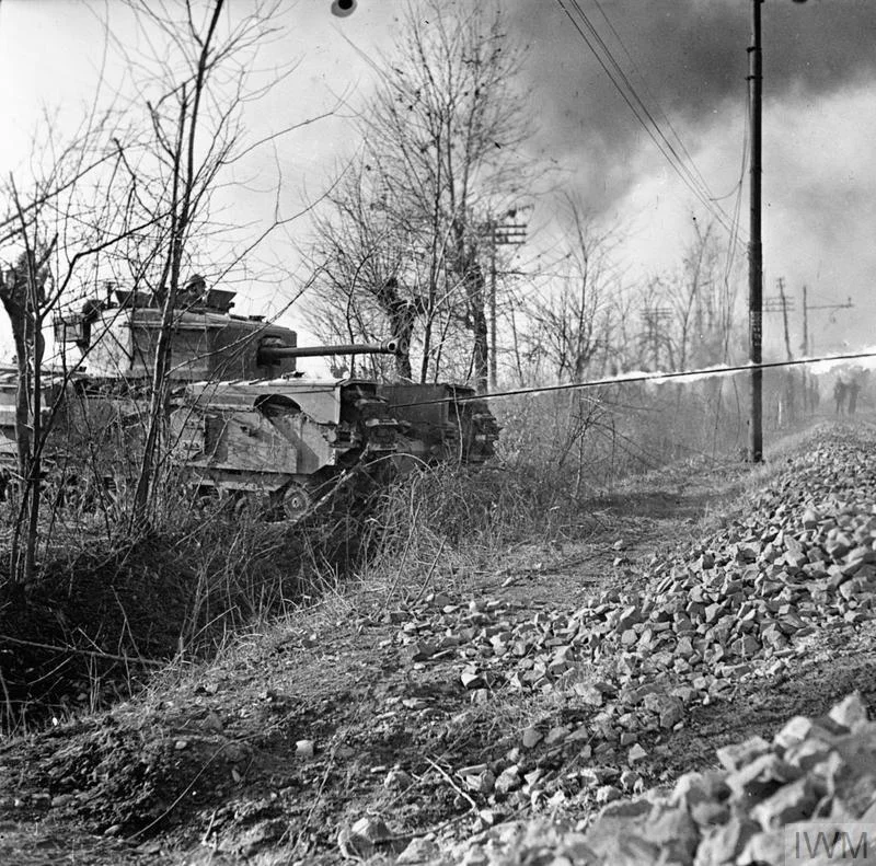 A Churchill Crocodile flamethrower in action during a demonstration near Faenza, Italy, 30 Dec 1944. IWM photo NA 21102.