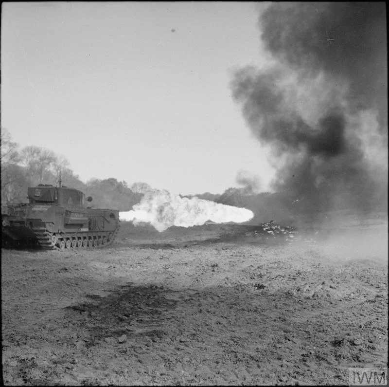 Churchill Crocodile flame-thrower in action during trials at Eastwell Park, Ashford, Kent, 26 Apr 1944. IWM photo H 37930.
