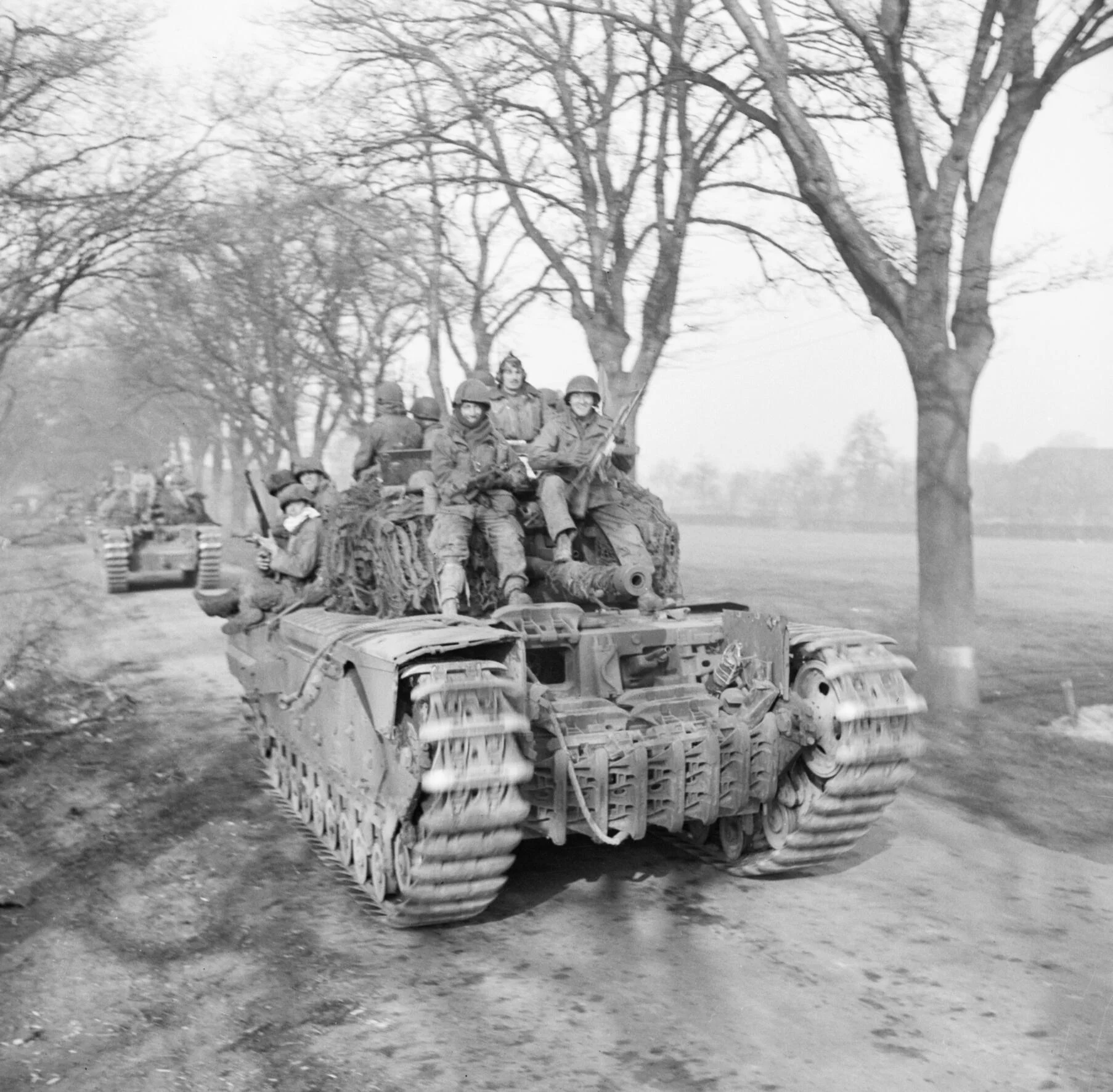 6th Guards Tank Brigade Churchills carrying paratroopers of the 17th US Airborne Division, Germany, 29 Mar 1945. IWM photo BU 2737. Note the front soldiers with captured MP-44 assault rifles. 