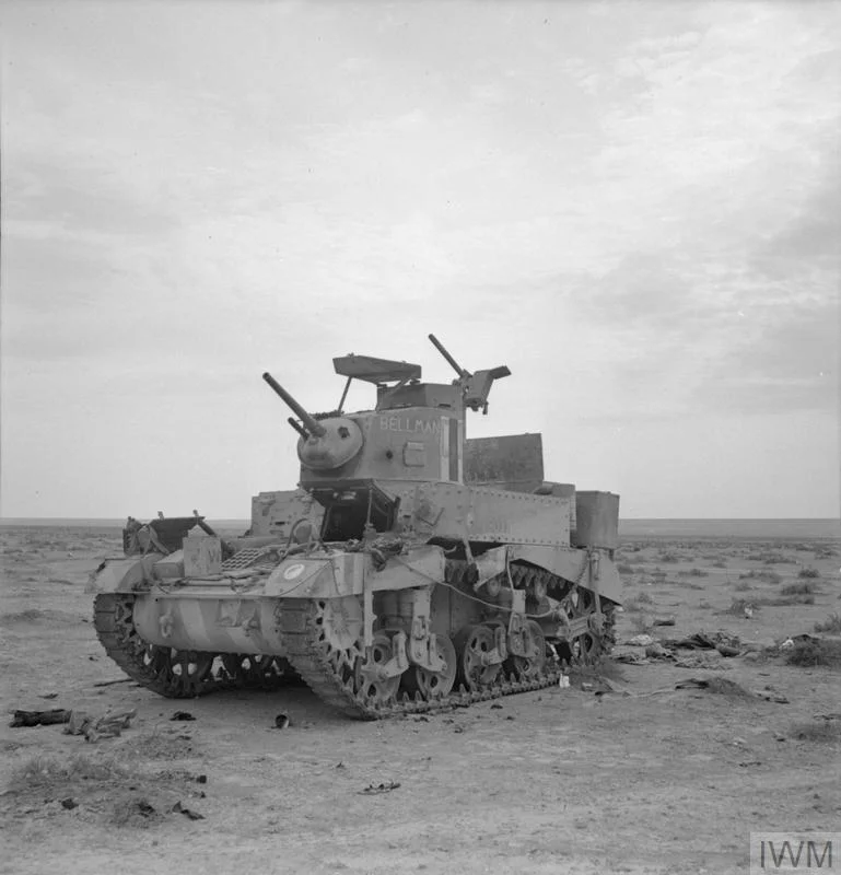 ''BELLMAN'', an M3 Stuart tank of 8th Hussars, 7th Armoured Division, knocked out near Tobruk, 15 Dec 1941. IWM photo E 7044.