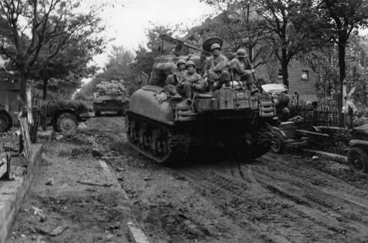 67th ARM RGT M4A1's with troops of the 116th INF RGT, 29th ID in Ubach, Germany. 1 Oct 1944