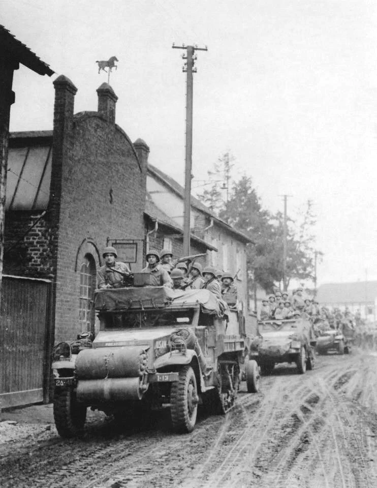 I CO, 41st AIB, halftracks enter Jüchen, Germany, 28 Feb 1945