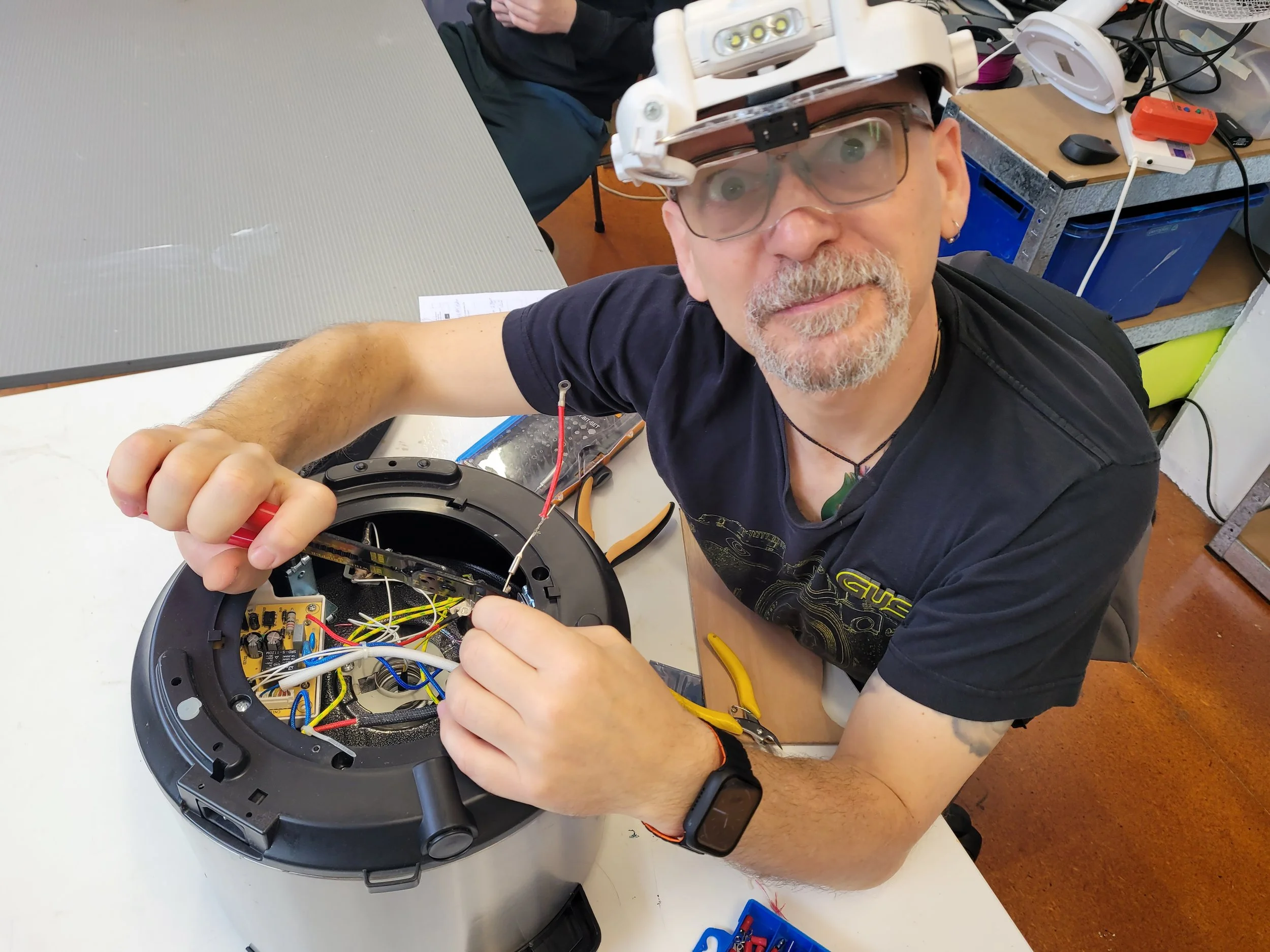 Auckland Library of Tools volunteer fixing during a repair cafe event