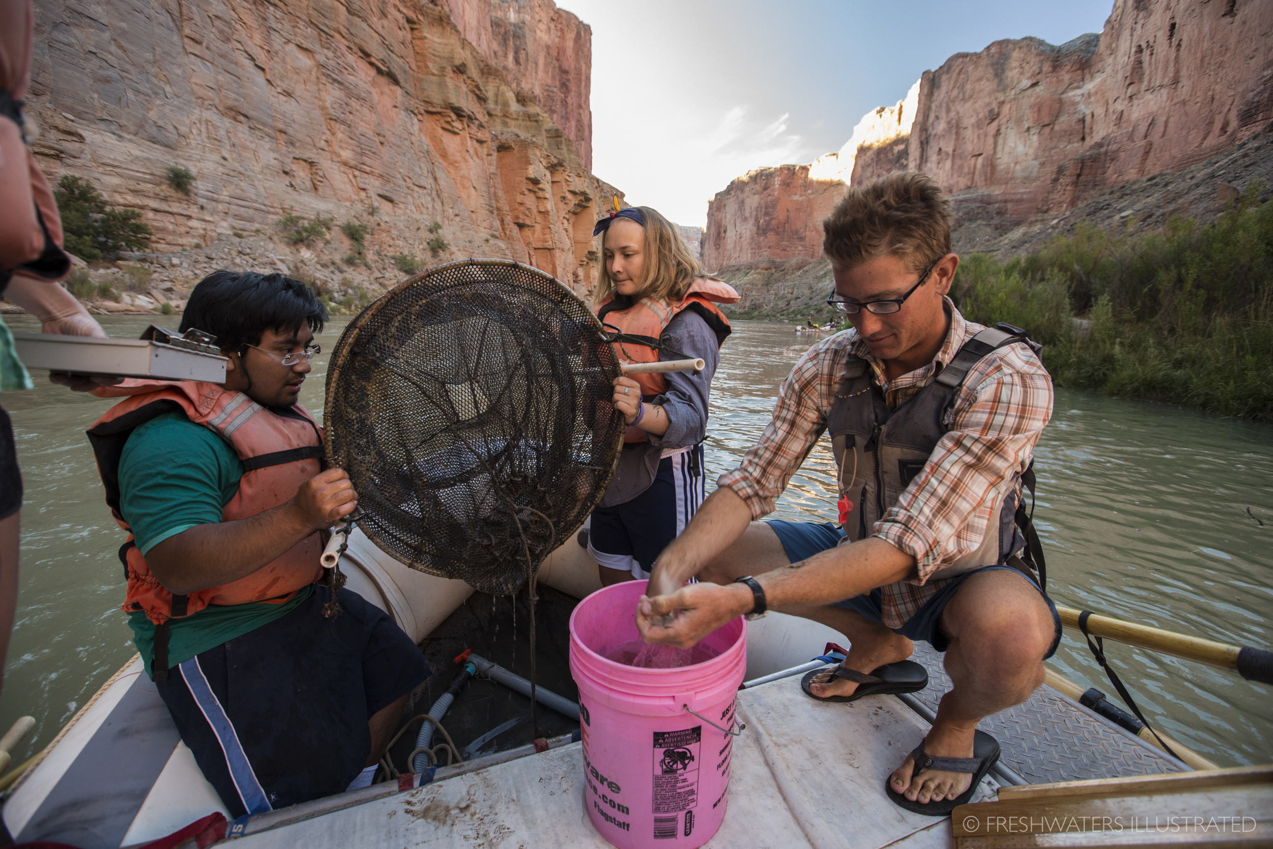  In search of the elusive humpback chub, kids and river guides from the U.S. Geological Survey (USGS) and Grand Canyon Youth check hoop nets to help collect information on the distribution of these rare fish. Data gathered on these youth trips is vit