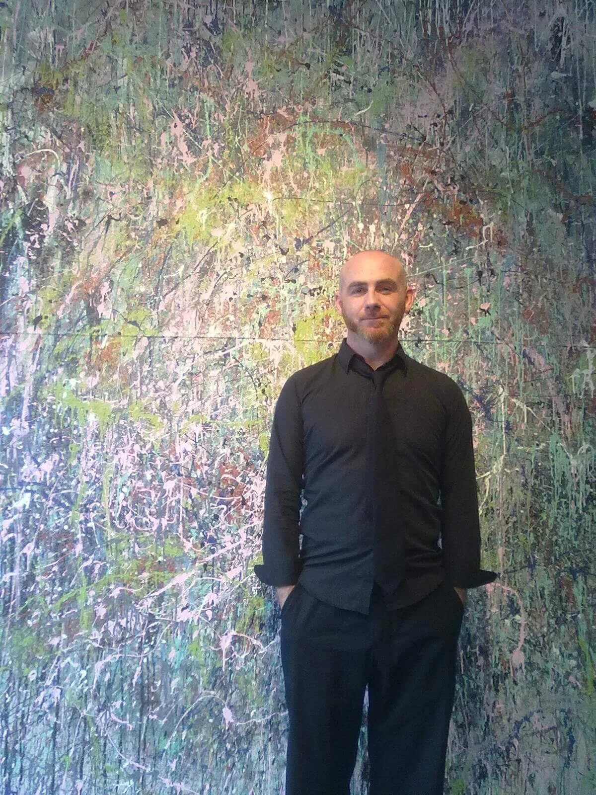 jody-mcgrath-poses-with-drip-painting.jpg