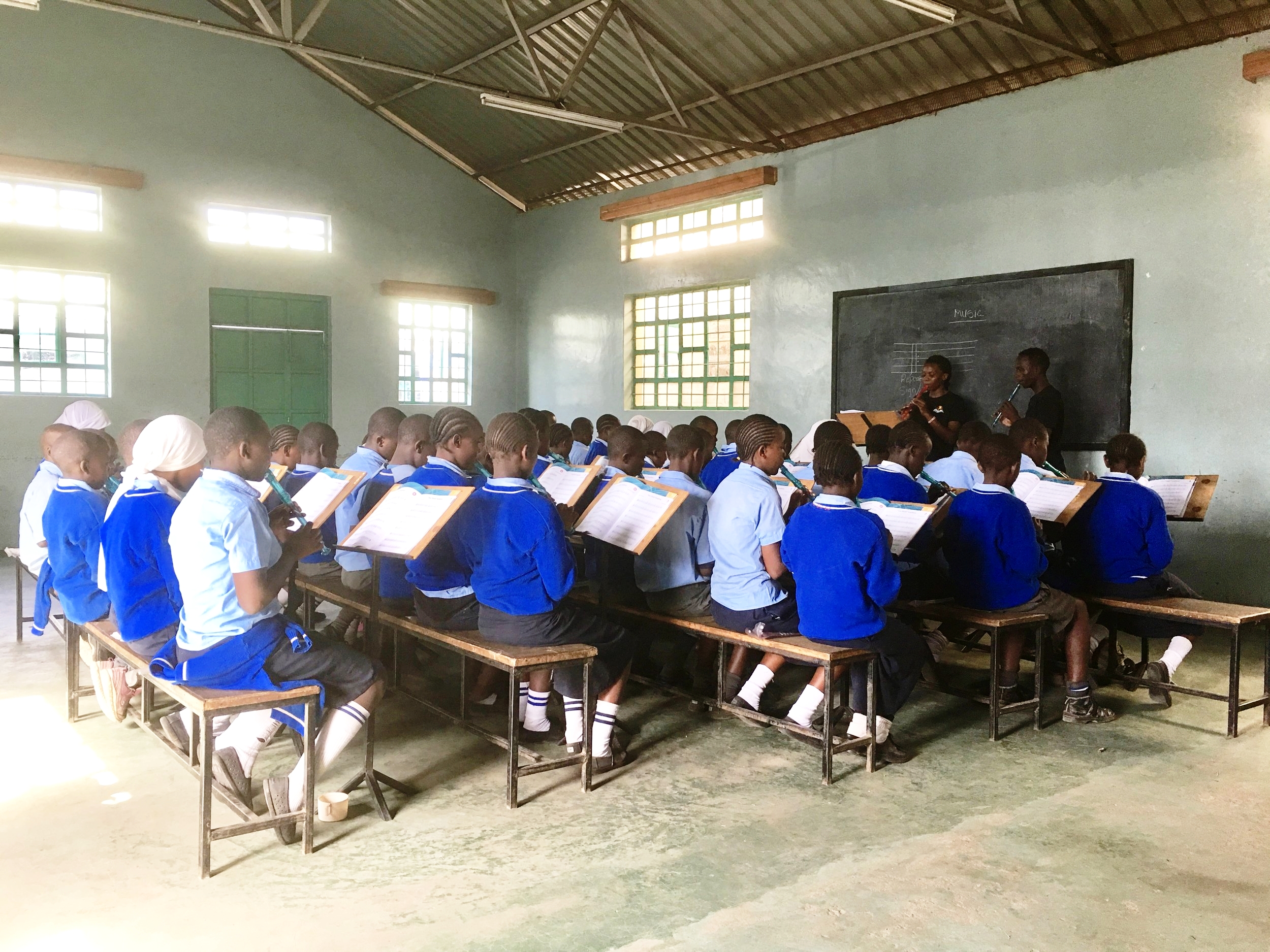 Music class in Korogocho Nairobi. All the students learn how to play the recorder, sight read and music theory. 