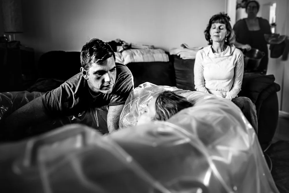 Husband mother and midwife all have jobs at this beautiful daytime home birth.jpg