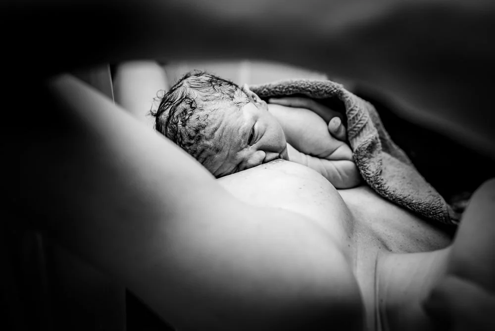 The first latch is an incredible bonding experience that mom's are so grateful to see when they've had their birth documented.jpg