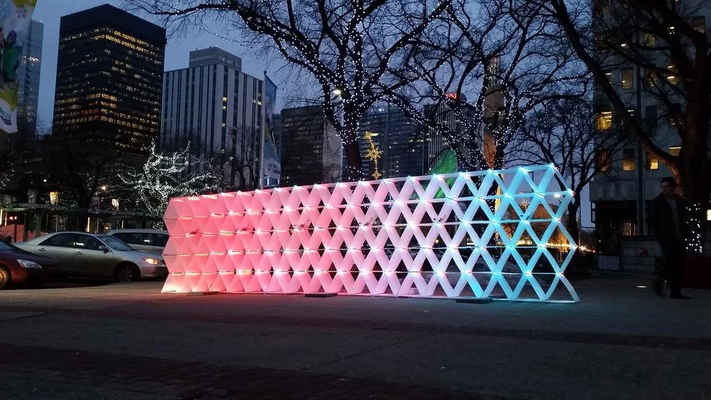  Fibre was created with Logan Grotkowski, Francisco Jimenez, and Heather vander Hoek  Built for WinterCity Shakeup.  FIBRE interacts with movement, with each side of the wall reacting differently. It is driven by 6 raspberry PIs (mostly as a result o