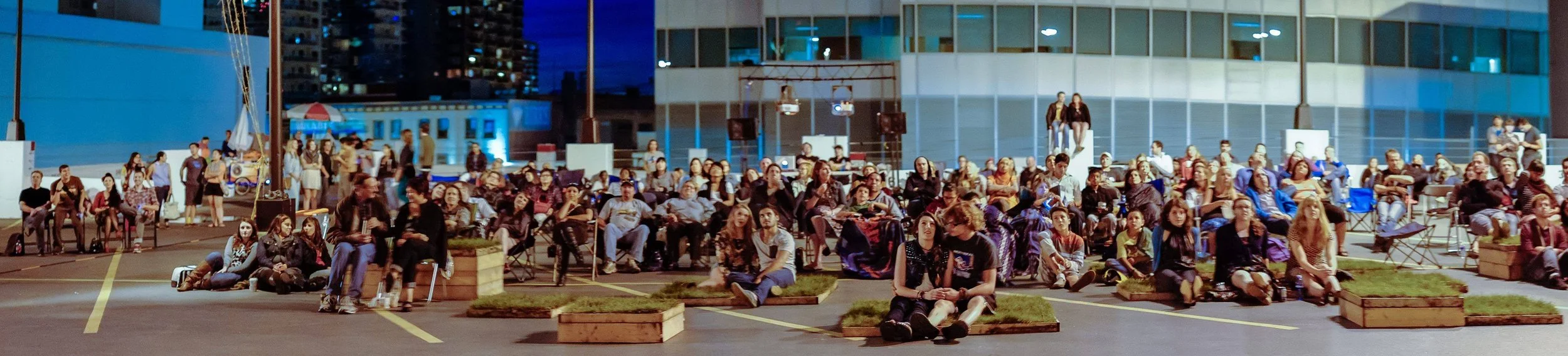  Blink team (Hannah MacDonald, Mack Male, and Sharon Yeo).  Initiating an idea about a rooftop parkade patio party, I co-founded an event in a unique setting. The idea kicked off with an Awesome Edmonton Foundation grant of $1000 in January of 2013. 