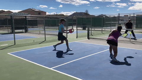 The woman in green’s forehand volley does not cause trouble for her opponents. The problem is exacerbated by misreading the return volley as she is unsure whether to take the ball in the air or off the bounce. This indecisiveness causes her to panic and play a lob which gets smashed. This is an example of how a missed opportunity (her first volley) can come back to haunt you.
