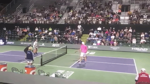 Yates (black shirt) moves his opponent Dave Weinbach with a good crosscourt. Weinbach is a little off balance so replies with a crosscourt of his own. Compared to down-the-line, crosscourt provides a larger target and lower net which makes it a good place to hit when in trouble. But Weinbach hits a little too wide, moving Yates outside the sideline.
