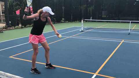 A gentle ball release (not throw) makes timing the serve easier. And by releasing the ball at waist height, the player guarantees that she will follow the rule of making contact below her waist.