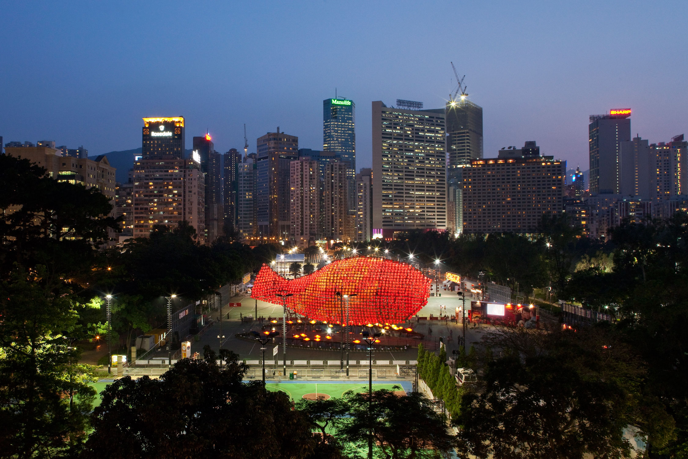 Occupying the space of a soccer field, the site measures 74m x 47m. The fish lantern measures 37m x 16.6m high x 9m, and consists of over 2,500 small lanterns.