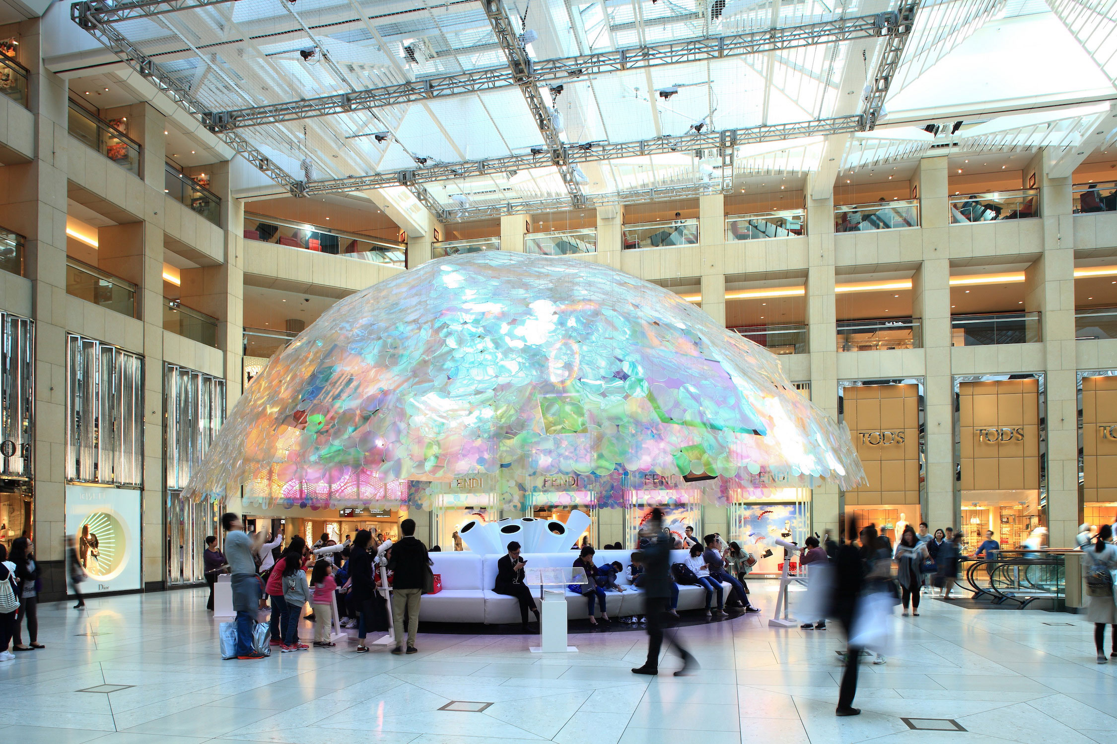 If architecture can be made for the people and better social interaction, then this temporary dome structure has done that. For a period of three weeks during Art Basel HK, the dome structure, made out of 5,000 acrylic iridescent discs, was home to nine distinctive paintings, including a Chagall and a Monet.