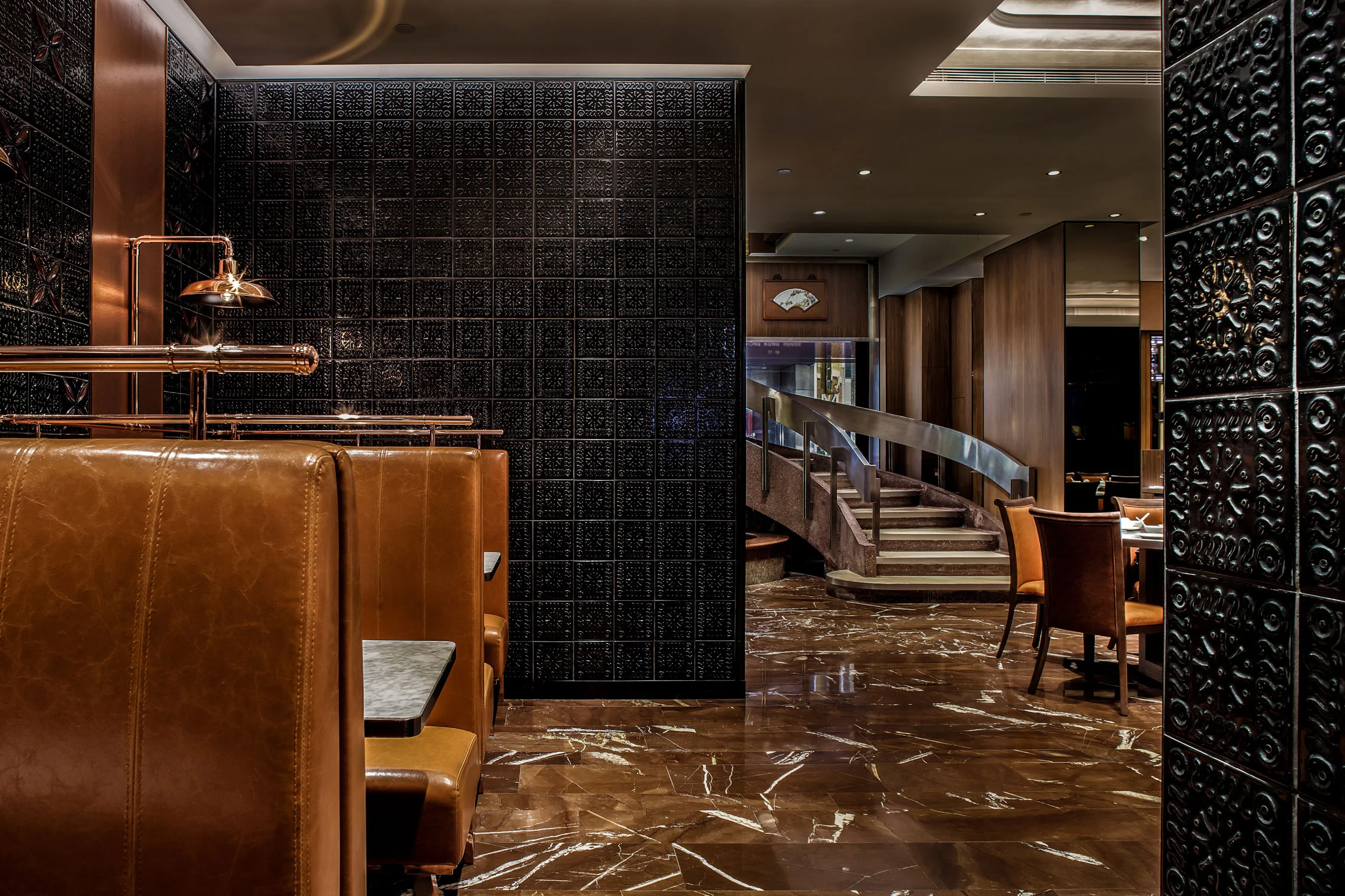 The vintage cast ceramic tiles were created locally by hand to become the unify motif for the restaurant. Research into the history of the restaurant warrant recreation of 3 booths seating displaced in the previous renovation. A retail shop is created with a long taste testing table. Dining ambience is greatly enhanced without compromising the restaurant’s heritage. As a result of reusing parts, a reduction in wastes is also achieved.